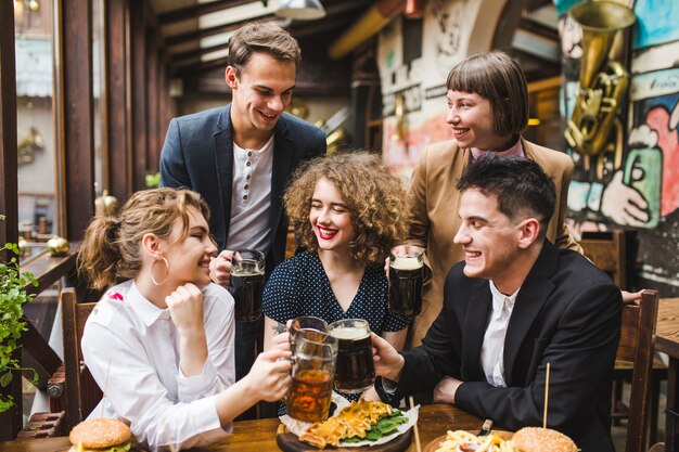 Friends eating and conversating in restaurant