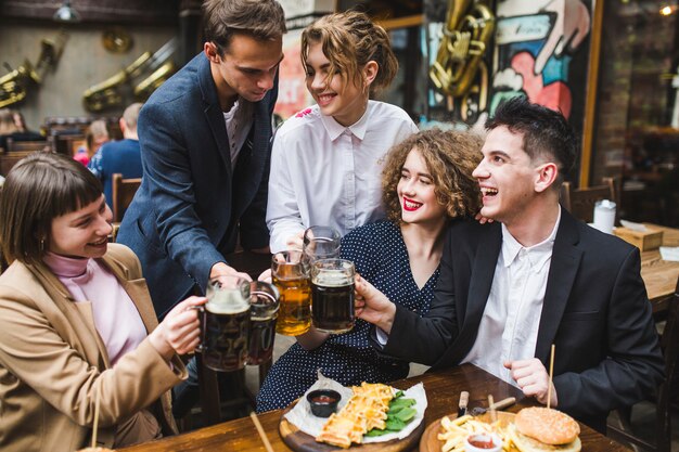 Friends eating and conversating in restaurant