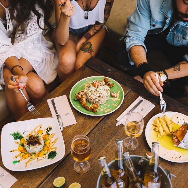 Friends eating in restaurant