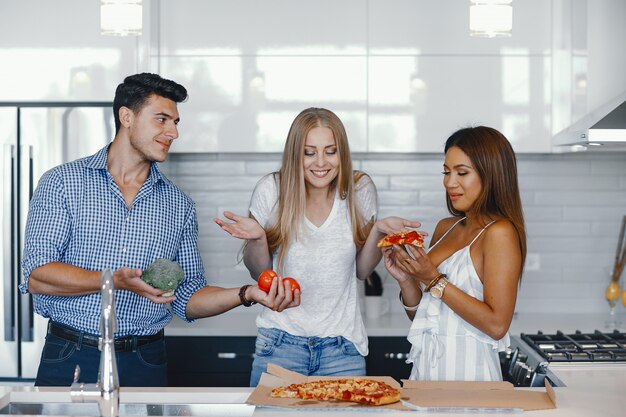 friends eatting in a kitchen