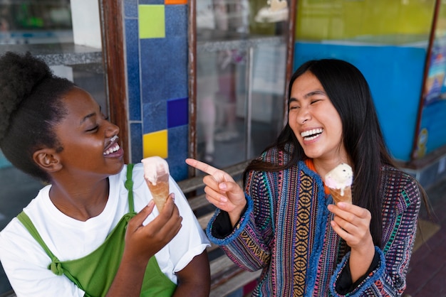 Free photo friends enjoying ice cream together