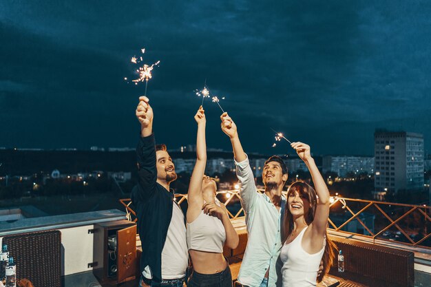 Friends enjoying a rooftop party