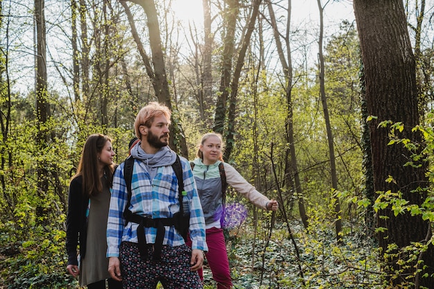 Friends exploring forest