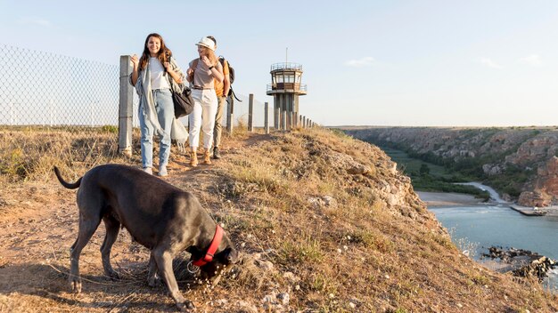 Friends exploring with their dog