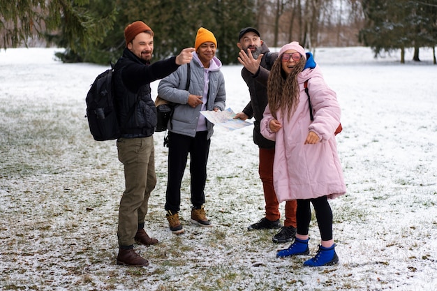 Free photo friends going hiking in winter