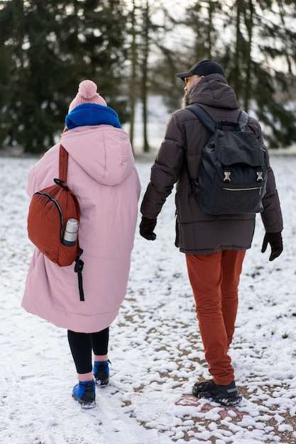 Free photo friends going hiking in winter