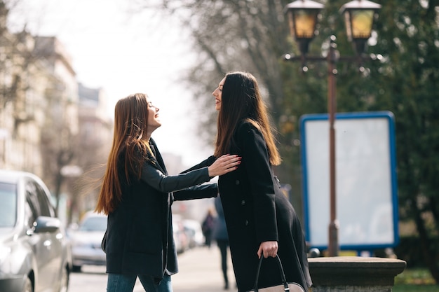 Friends greet each other on the street