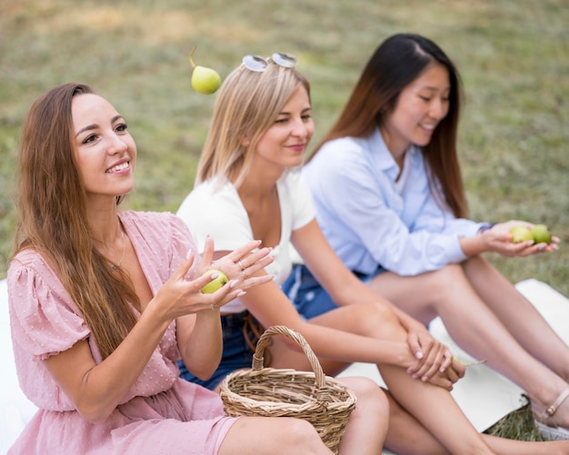 Free photo friends hanging out together outdoors back to normal