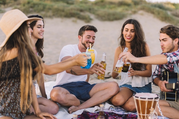 Friends having a drink at the beach