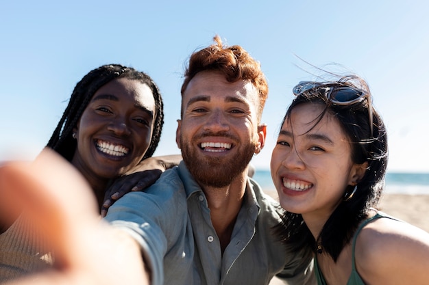 Friends having fun by the sea side