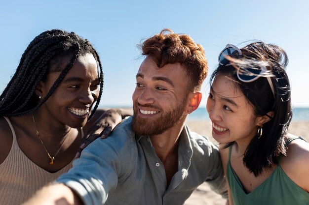 Friends having fun by the sea side