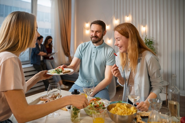 Friends having fun together while cooking