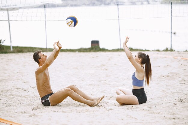 Friends having fun at voleyball playground