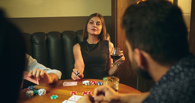 Friends having fun while playing board game.