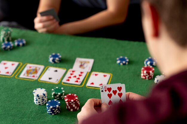 Friends having fun while playing poker