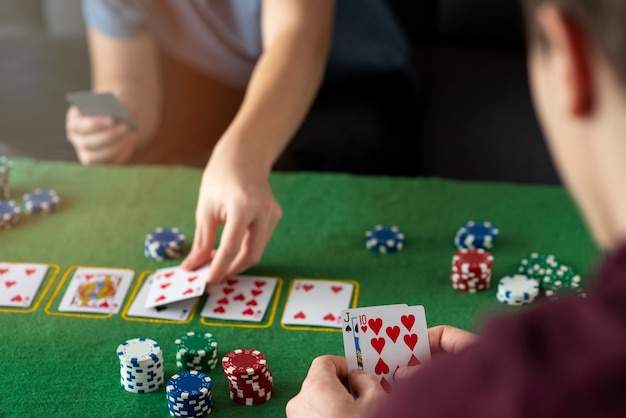 Friends having fun while playing poker