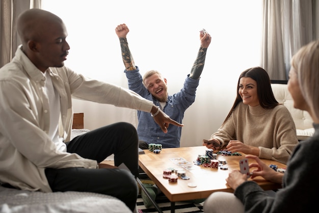 Friends having fun while playing poker