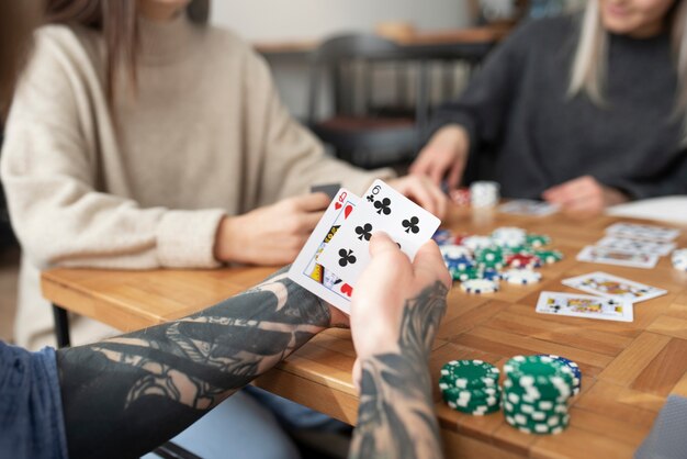 Friends having fun while playing poker