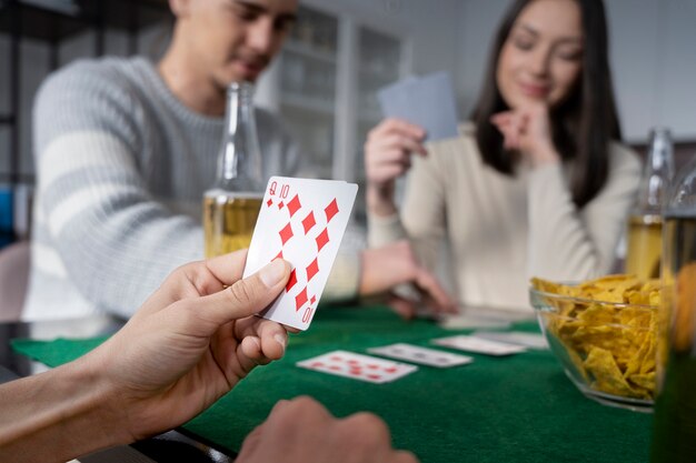 Friends having fun while playing poker