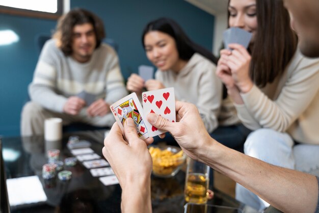 friends having fun while playing poker