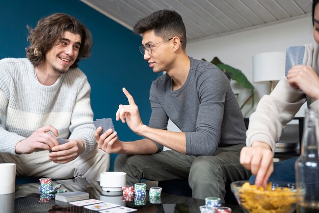 Friends having fun while playing poker