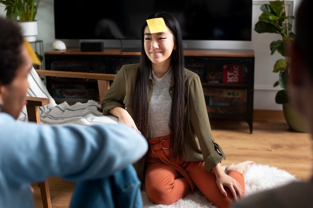 Free photo friends having fun with traditional games