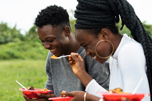 Friends having lunch together side view