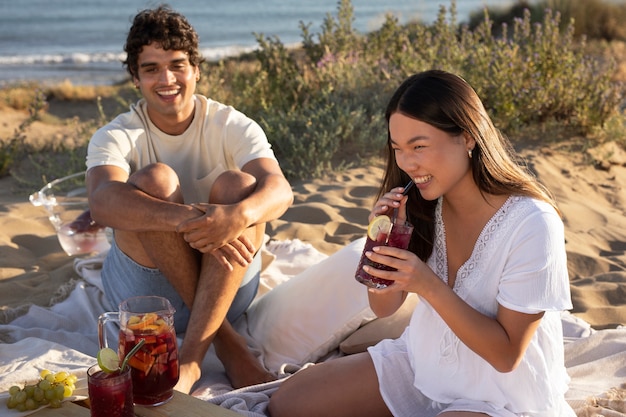 Friends having a sangria party by the beach