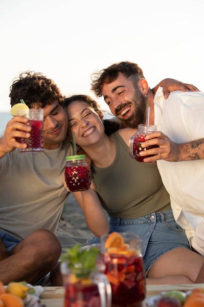 Friends having a sangria party by the beach