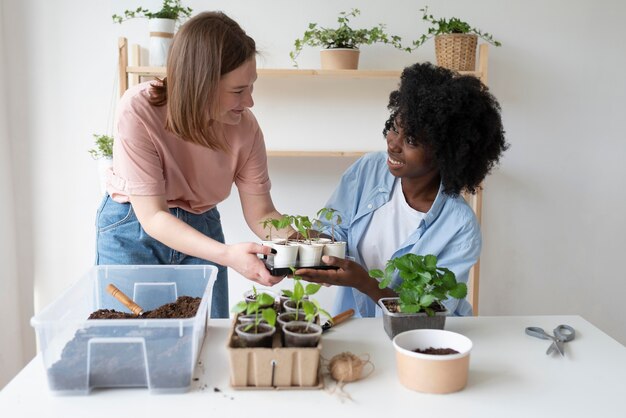 Friends having a sustainable garden indoors