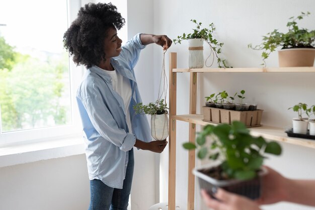 Friends having a sustainable garden indoors