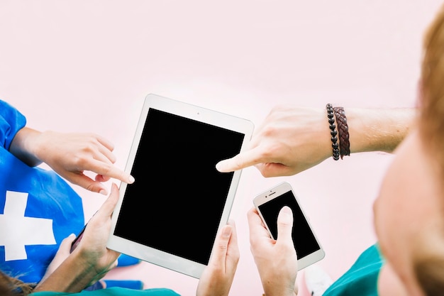 Friends holding tablet in hand