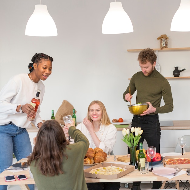 Friends at home having lunch