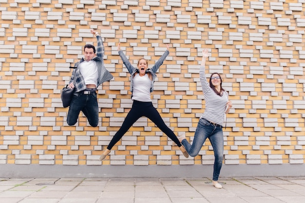 Friends jumping outside