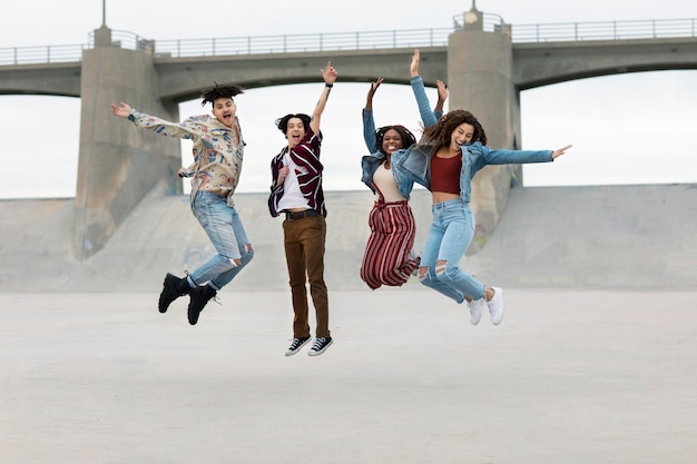 Friends jumping while out in the city