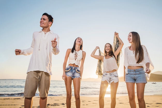 Friends laughing at beach party