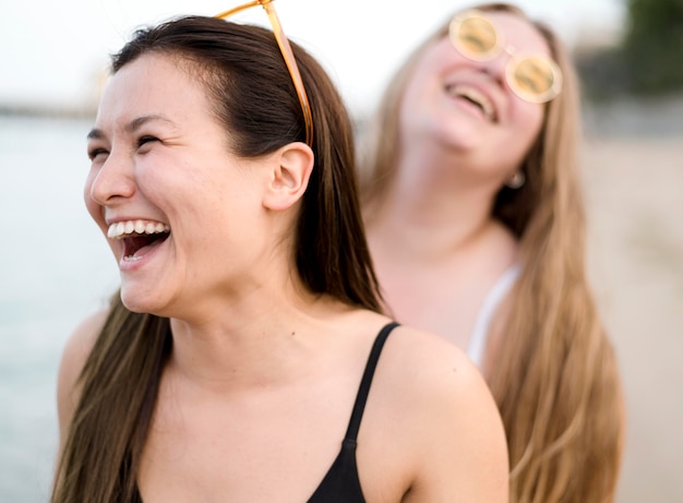 Friends laughing at the beach