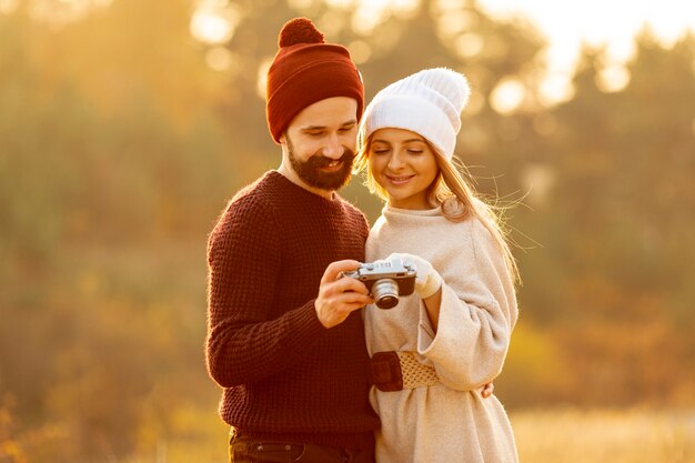 Friends looking at photos on camera