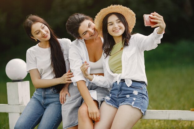 Free Photo friends makes a selfie. girl in a hat. woman in a white t-shirt.