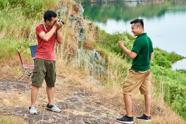 Friends photographing outdoors