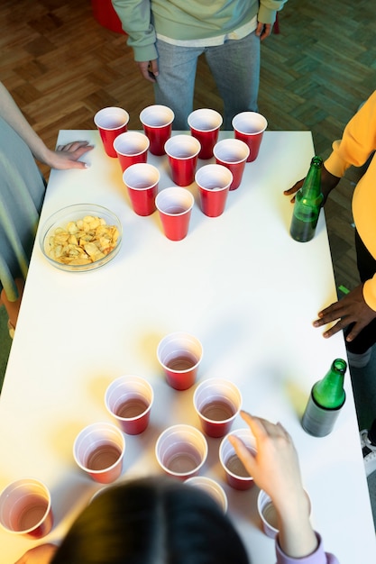 Friends playing beer pong