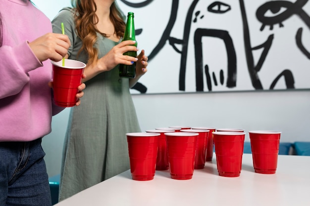 Friends playing beer pong