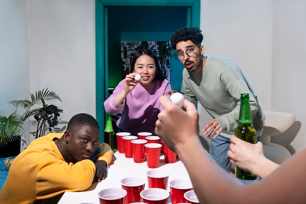 Free photo friends playing beer pong