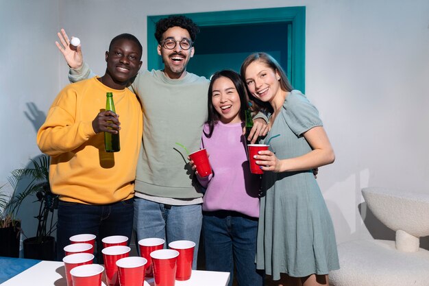 Friends playing beer pong