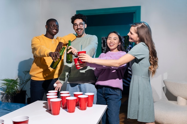 Free photo friends playing beer pong