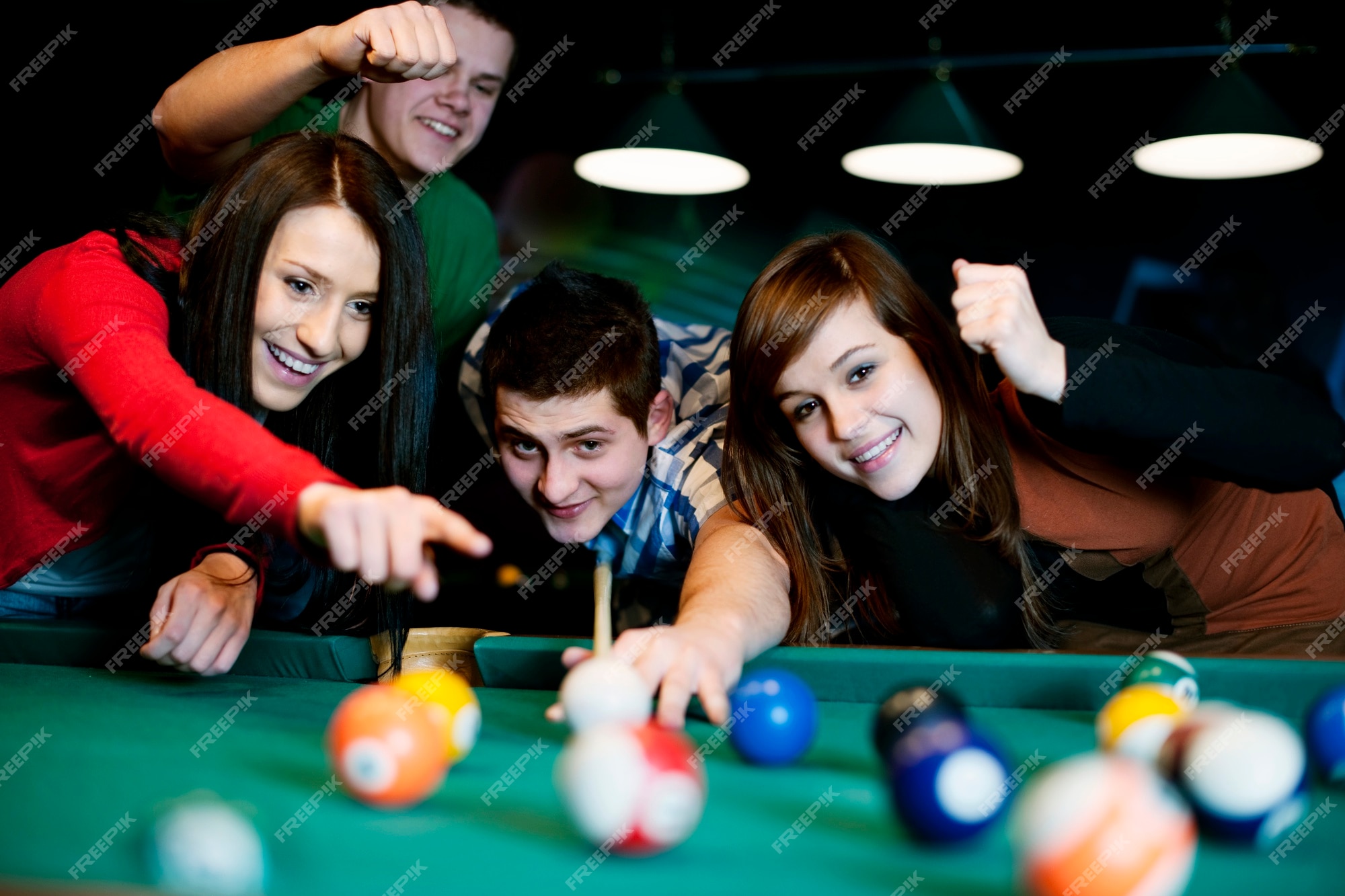 Billiards game. young friends playing pool together Stock Photo - Alamy