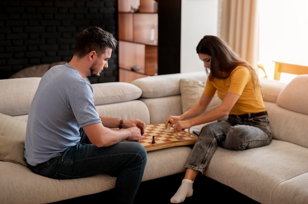 Friends playing chess game