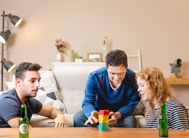 Friends playing games together and having beer