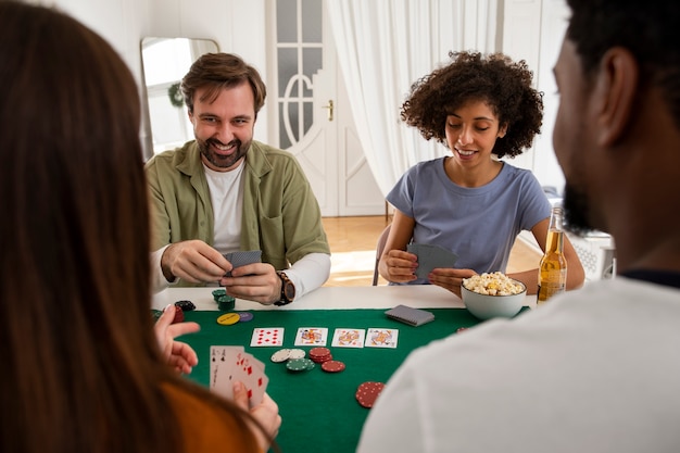 Free photo friends playing poker together