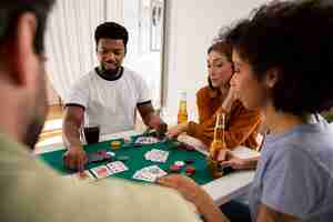 Free photo friends playing poker together